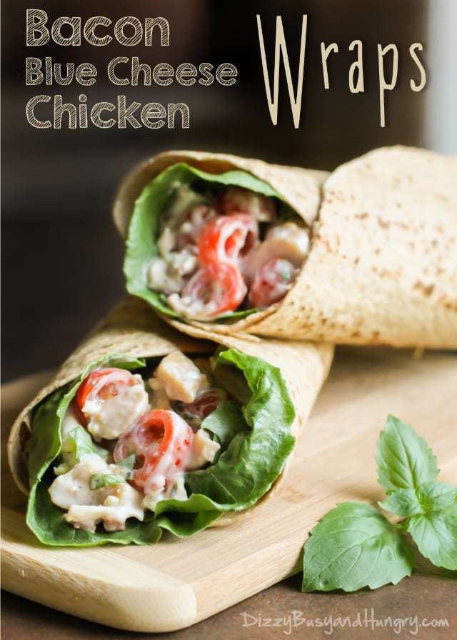 Side view of bacon blue cheese chicken wrap stacked on each other on a wooden surface. 