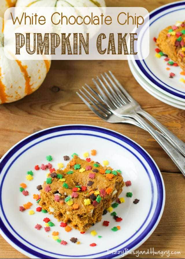 Side view of white chocolate chip pumpkin cake on a white and blue striped bowl with forks in the background. 