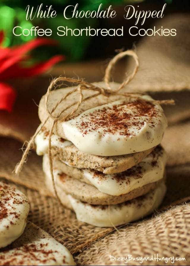 Side view of white chocolate dipped coffee shortbread cookies wrapped in a burlap string. 