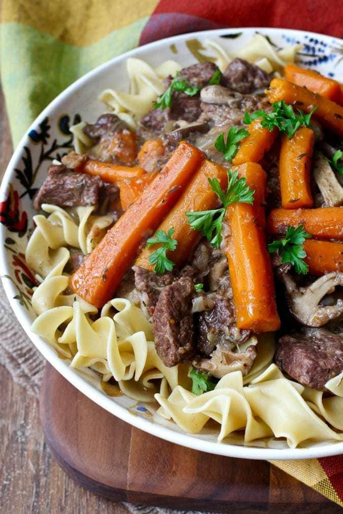 Close up shot of instant pot beef Burgundy in a white bowl.