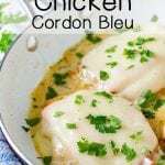 Side view of chicken cordon bleu in white skillet garnished with herbs. 