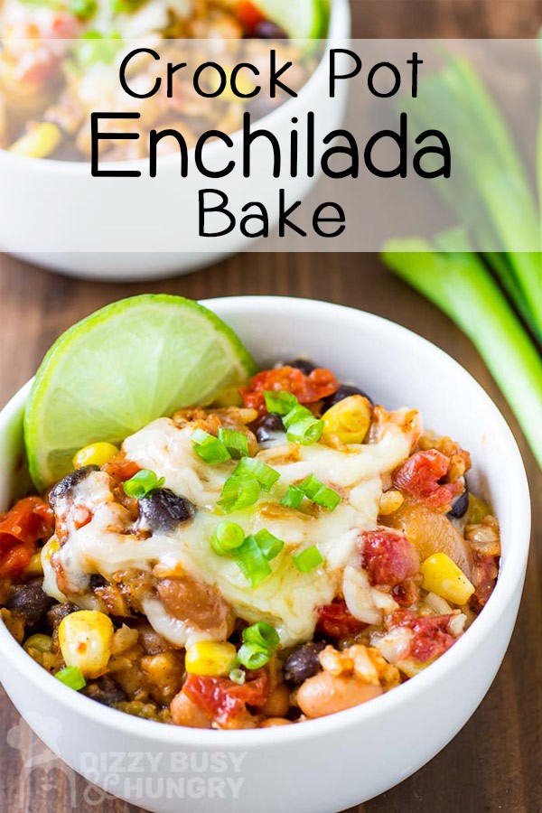 Side view of enchilada bake with a slice of lime on the side in a white bowl.