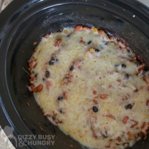 Overhead view of process shot- crock pot after cheese is melted. 
