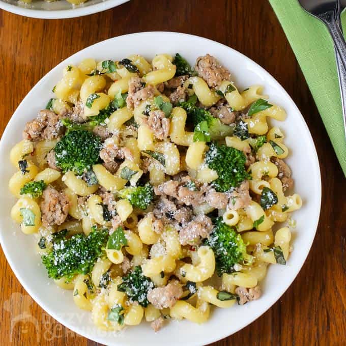 Overhead view of ground turkey pasta broccoli dinner on a white dish