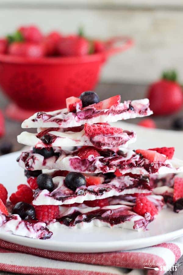 Pieces of berry yogurt bark stacked on top of each other - After School Snacks