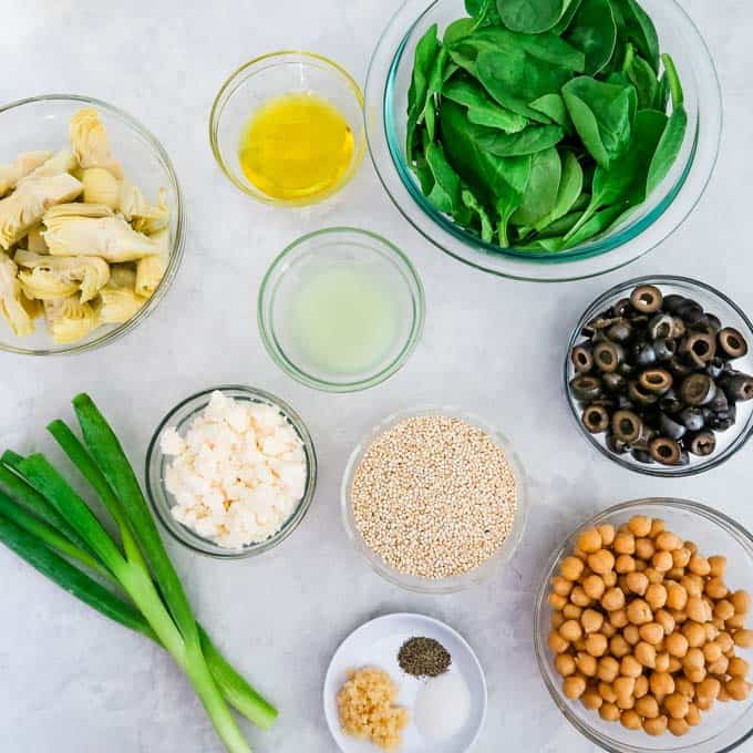 Ingredients- Artichoke hearts, garlic, olive oil, lime juice, salt, pepper, chickpeas, olives, spinach, scallions, and feta.