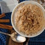 top view of a chai-spiced oatmeal in a white bowl. Slow cooker Breakfast Oatmeal