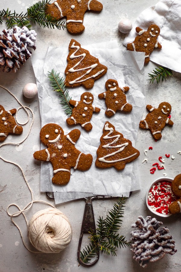 Top view of vegan gingerbread cookies shaped as Christmas trees and the gingerbread man - Easy Christmas cookies