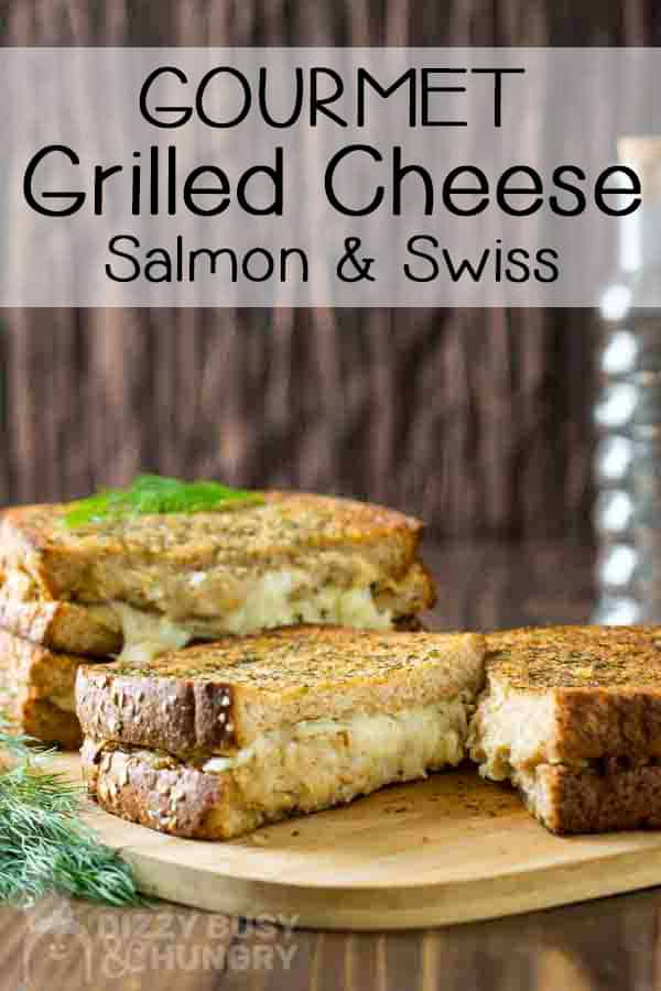 salmon grilled cheese easy seafood recipe with inside view of gooey cheese and crispy grilled bread on a wooden cutting board