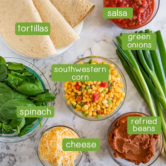 Overhead shots of ingredients- tortillas, salsa, green onions, spinach, southwestern corn, refried beans, and shredded cheese.