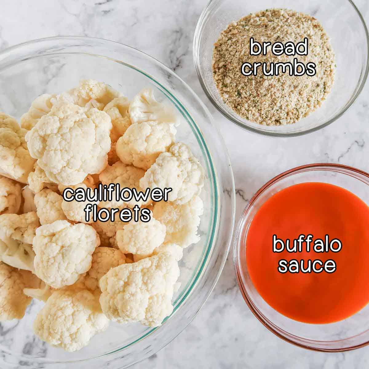 Overhead shot of ingredients- cauliflower florets, bread crumbs, and buffalo sauce.