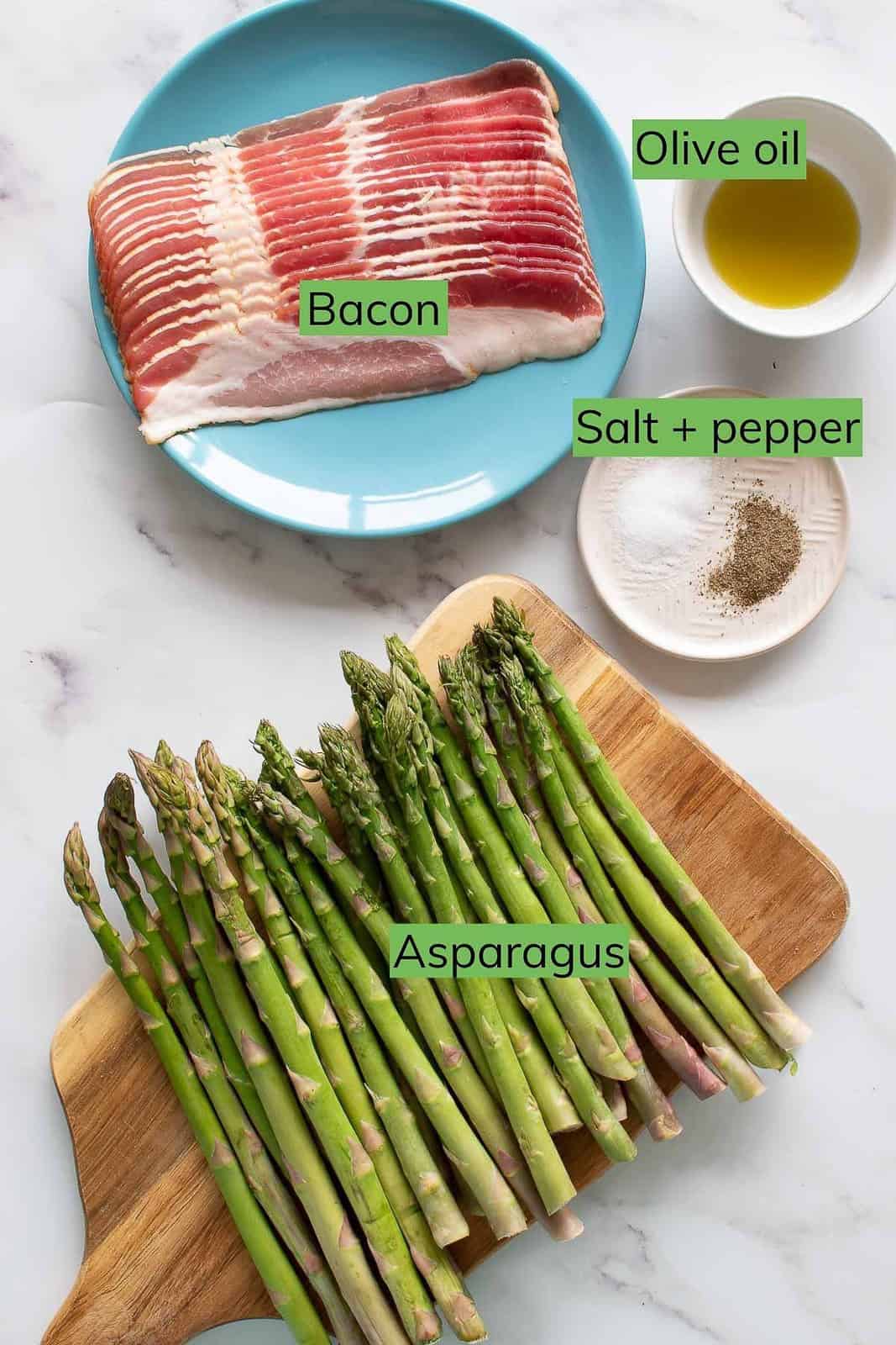 The ingredients for bacon wrapped asparagus laid out on a table.