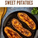 Overhead view of 3 sweet potato halves on a black plate sprinkled with a melty brown sugar cinnamon topping.