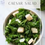 Bowl of kale caesar salad with croutons.