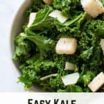 Bowl of kale caesar salad with croutons.