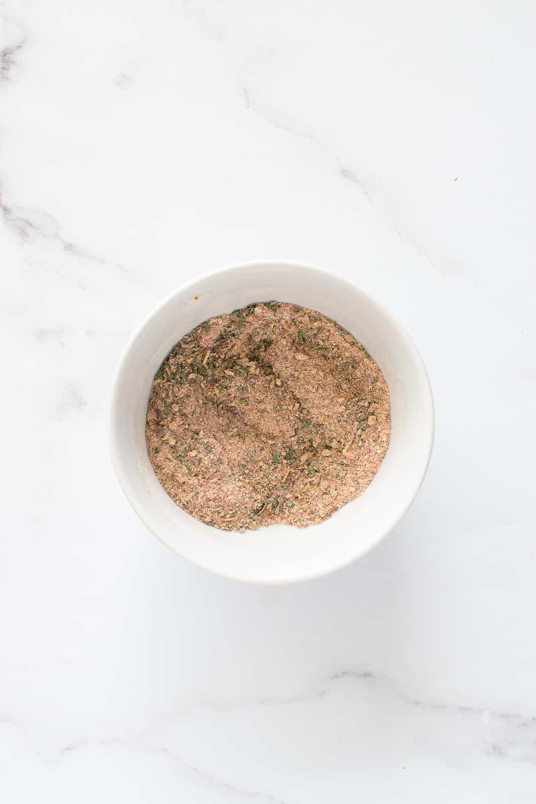 Mixed french fry seasoning in a bowl.