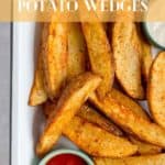 Air fried potato wedges on a plate with ketchup.