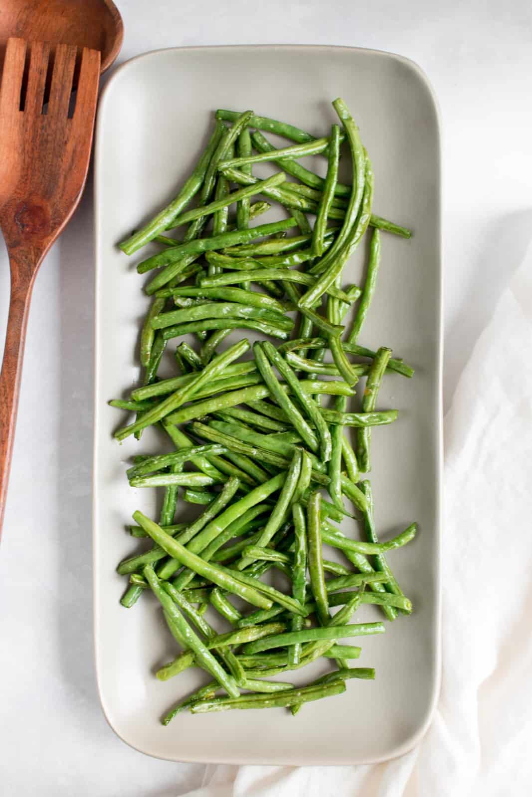 Overhead view of a platter of air fryer green beans.