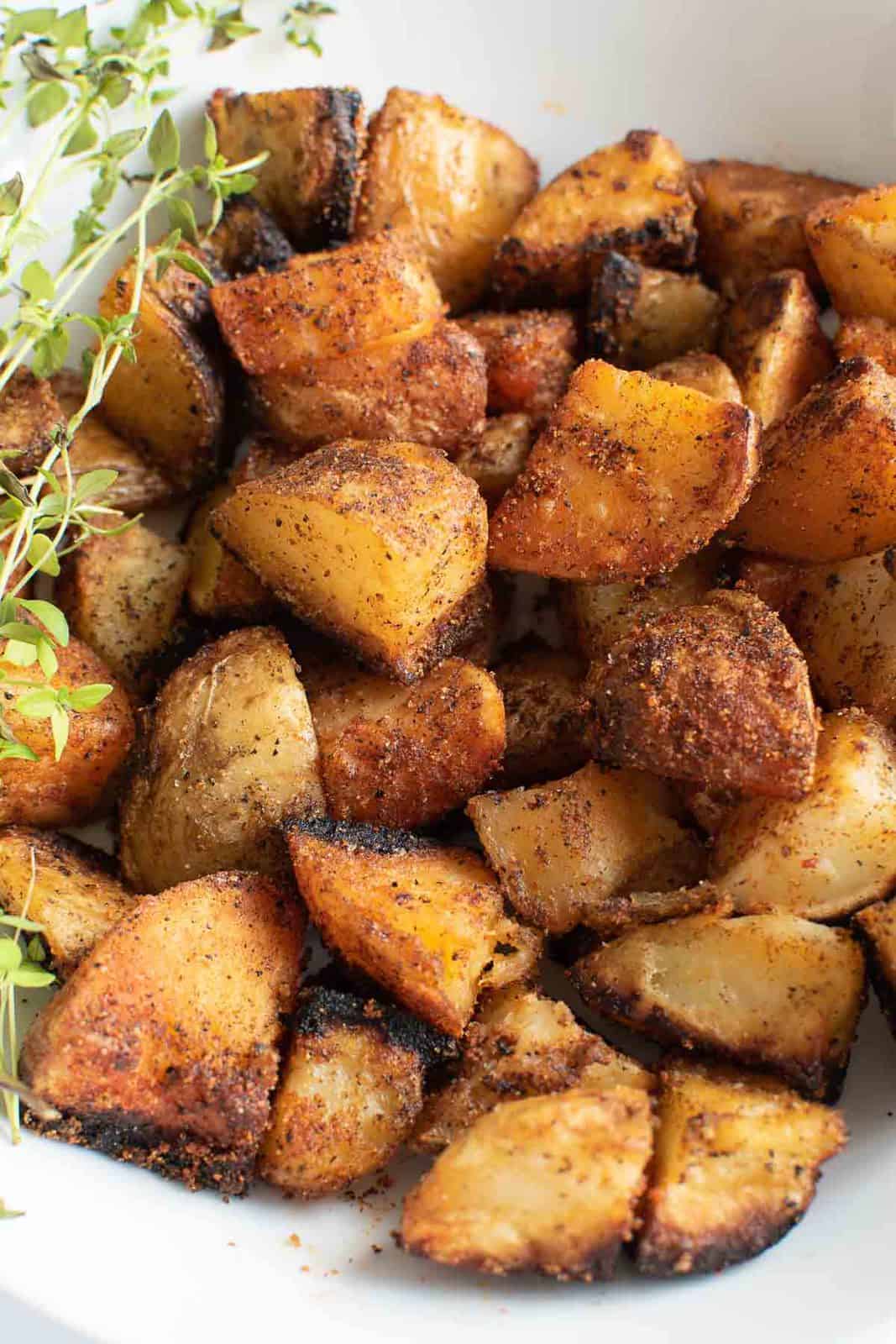 Close up of sauteed potatoes in a bowl.