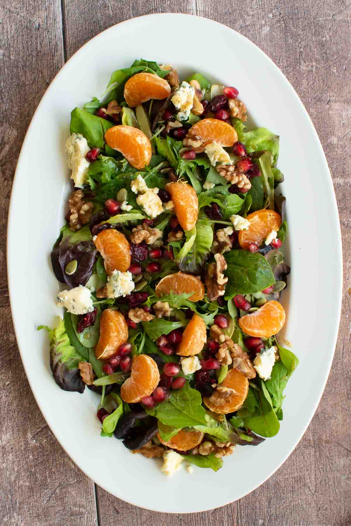 Holiday side salad with blue cheese, oranges and cranberries.