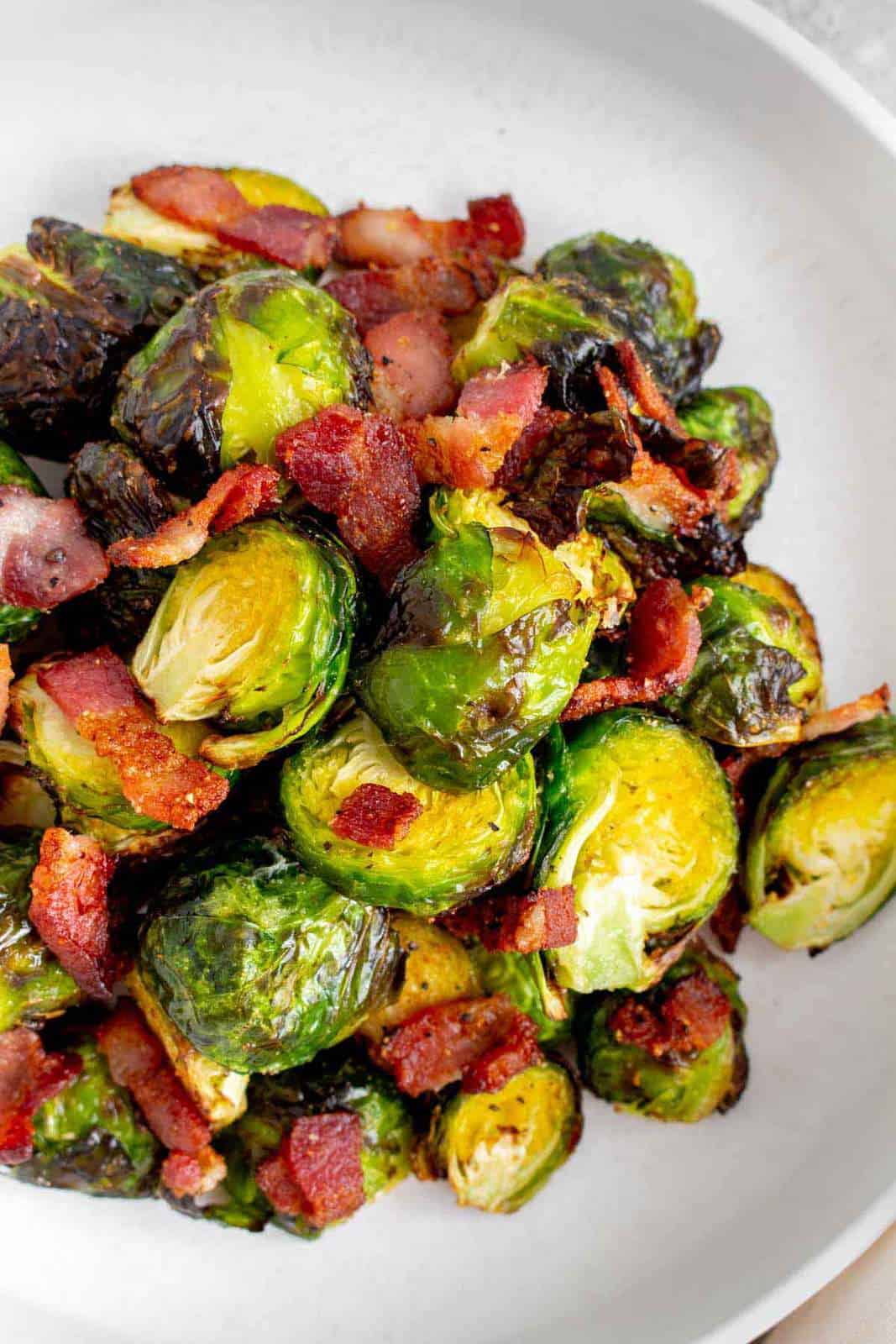 Close up of brussels sprouts and bacon.
