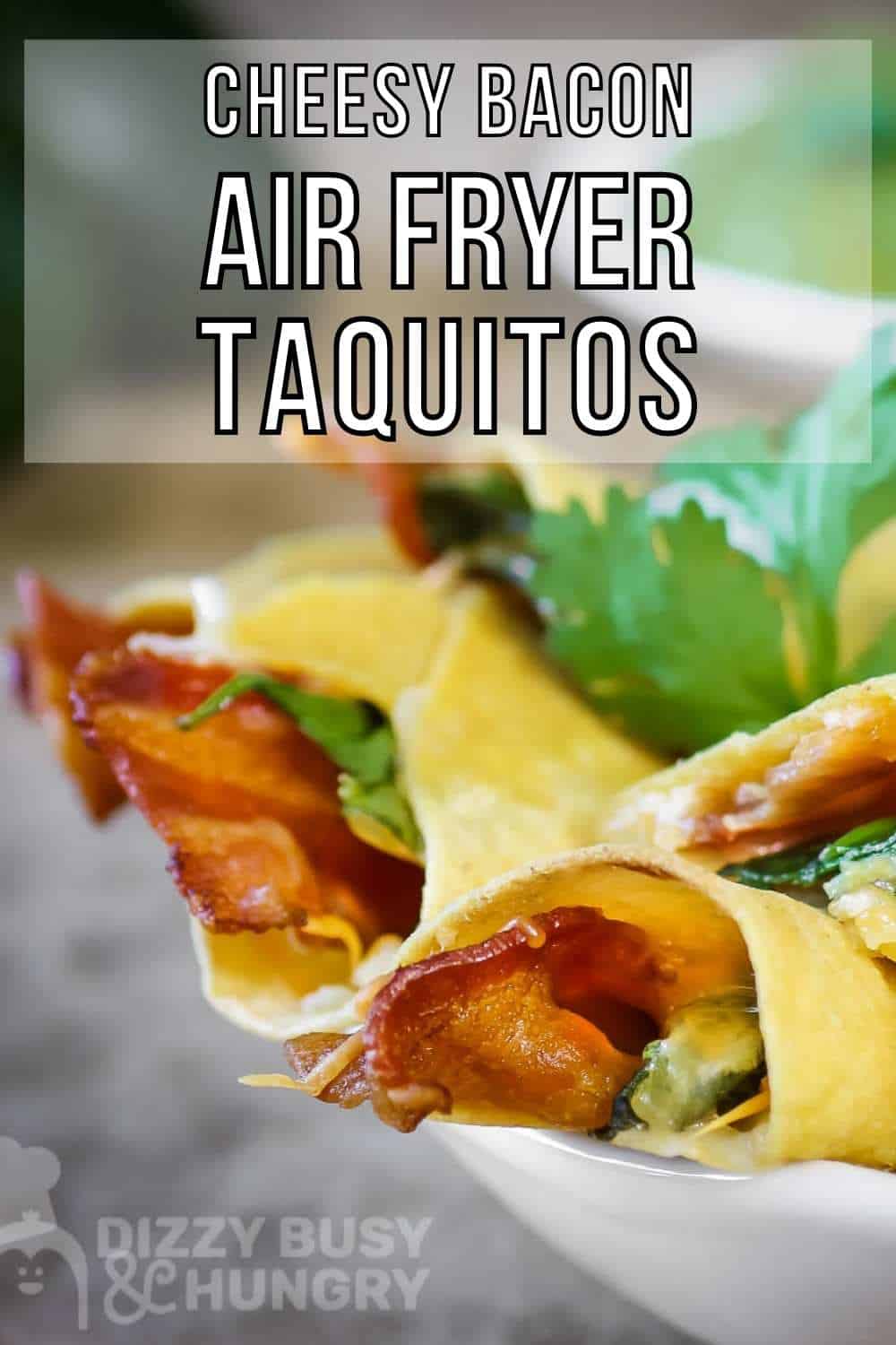 Side shot of taquitos layered on a white plate garnished with cilantro with a bowl of guacamole in the background.