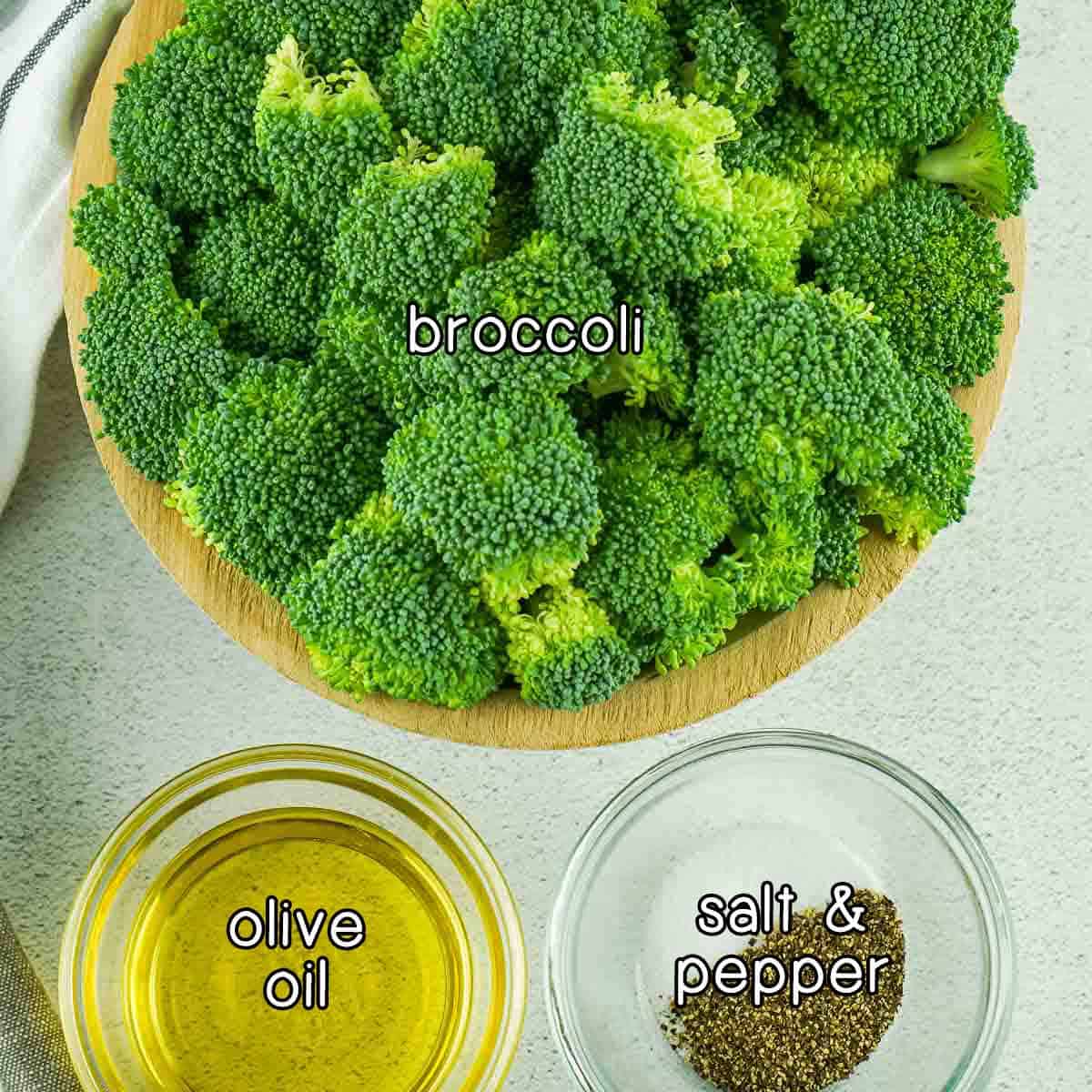 Overhead shot of ingredients - broccoli, olive oil, and salt and pepper.