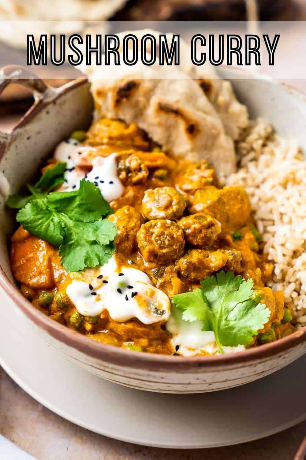 Side close up shot of tikka masala with rice and naan in a brown speckled bowl on a matching plate garnished with yogurt and parsley.