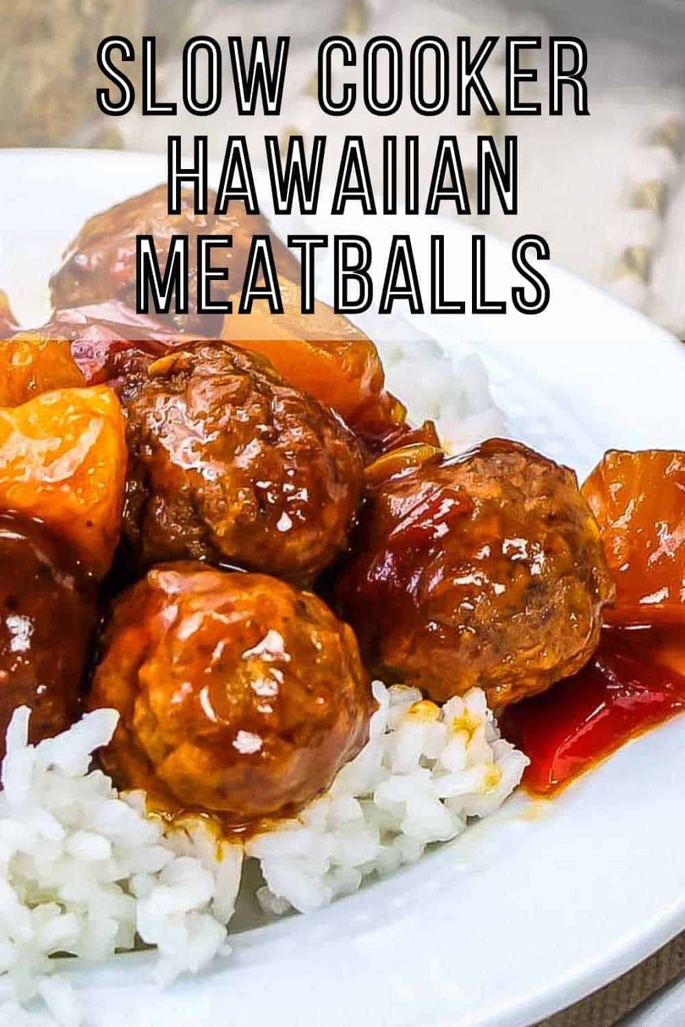 Side angled shot of Hawaiian meatballs over white rice in a white bowl with a white and yellow cloth in the background.