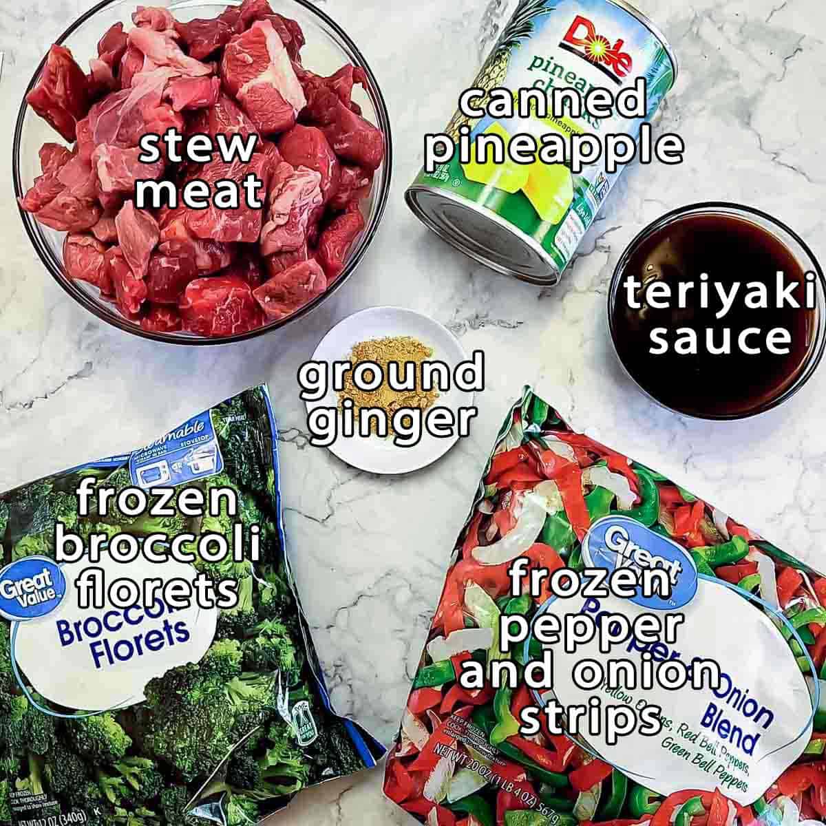 Overhead shot of ingredients - stew meat, canned pineapple, frozen broccoli florets, frozen pepper and onion strips, teriyaki sauce, and ground ginger.