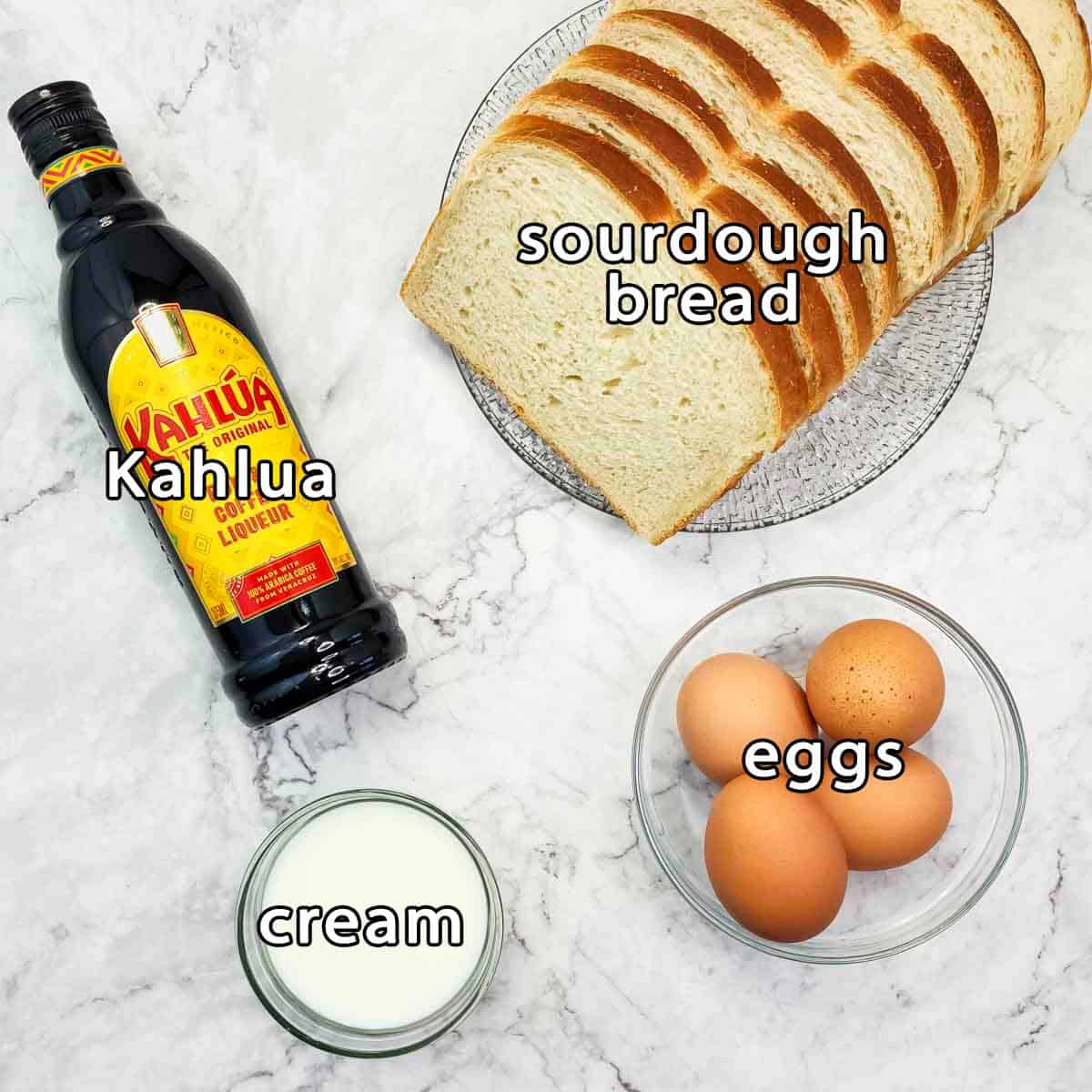 Overhead shot of ingredients - kahlua, sourdough, eggs, and cream.
