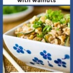 Side shot of a white and blue square bowl with zucchini fried rice garnished with green onions on a burlap cloth and chopsticks on the side.