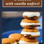 Side shot of multiple microwave s'mores stacked on each other on a blue plate.