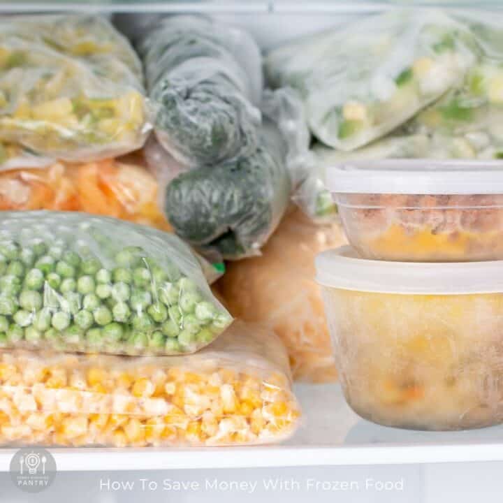Photo of frozen vegetables in bags stacked in a freezer.