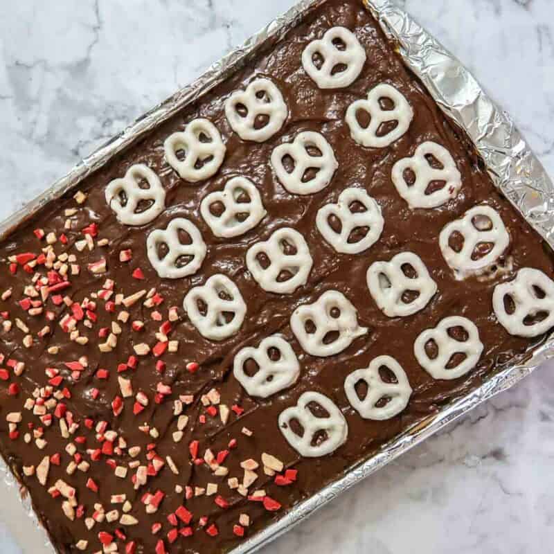 Overhead view of process shot 6 - add your desired toppings and gently press into the chocolate. Place the pan in the fridge for about 30 minutes or until cooled.