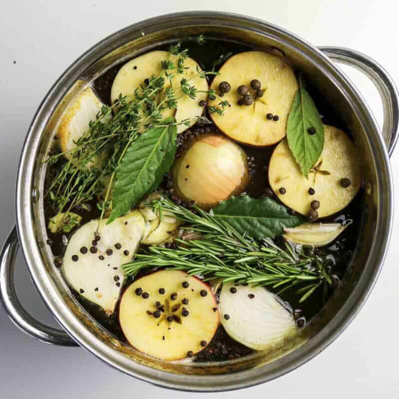 Overhead view of process shot 2 - stir in the remaining ingredients. Let the brine cool completely.