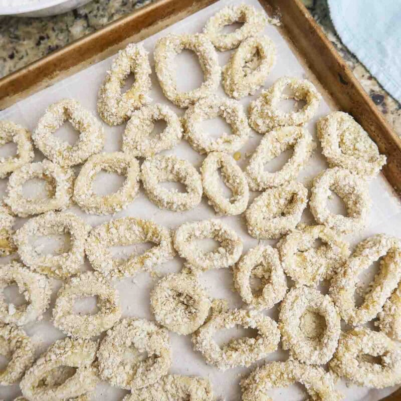 Overhead view of process shot 5 - place rings on the baking sheet and mist with cooking spray. Bake for 10 minutes.