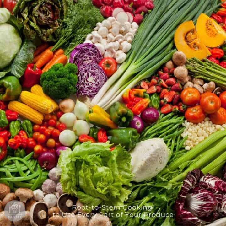 Overhead photo of many colorful vegetables randomly placed together to illustrate the concept of root-to-stem cooking.