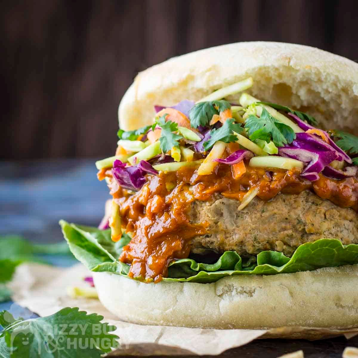 Side close up shot of thai turkey burger garnished with fresh parsley.