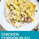 Overhead shot of chicken cordon bleu pasta garnished with fresh herbs on a white plate with a fork on the side.