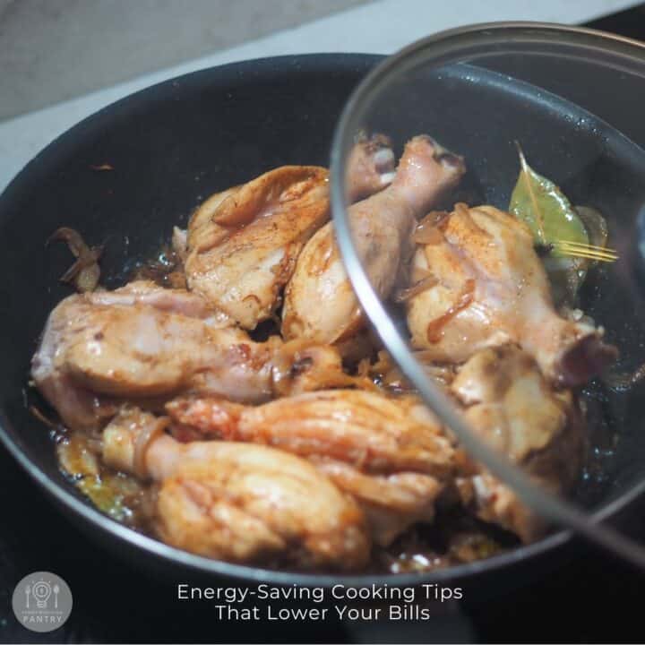 Photo of chicken cooking in a skillet on the stovetop to illustrate energy-saving cooking tips.