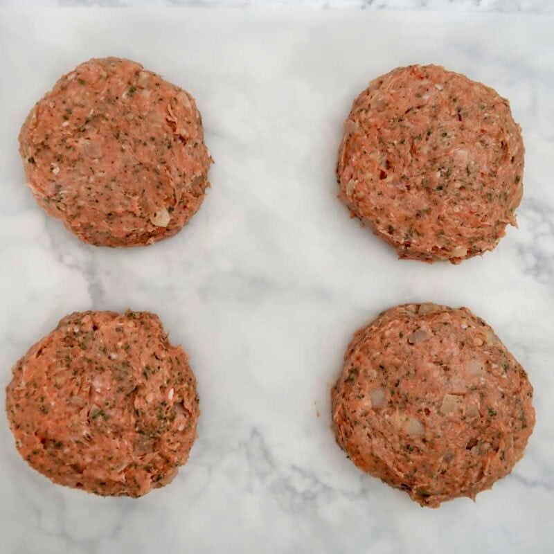 Overhead view of burger process shot 3 - divide the burger mixture into 4 sections and form each section into a patty.