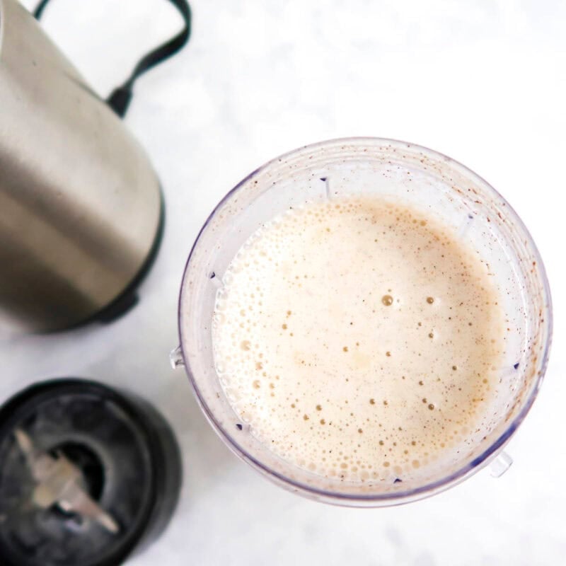 Overhead view of process shot 3 - top with cinnamon and a few diced apple pieces.