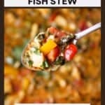 Close up shot of a spoon holding a bite of stew over a pot of stew.