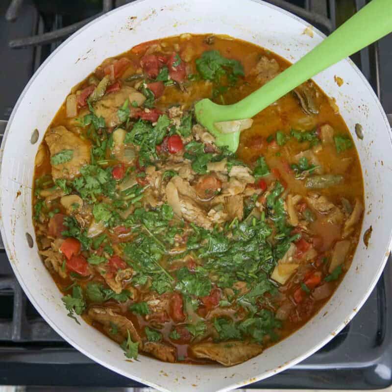 Overhead view of process shot 5 - in the last few minutes, stir in the cilantro.
