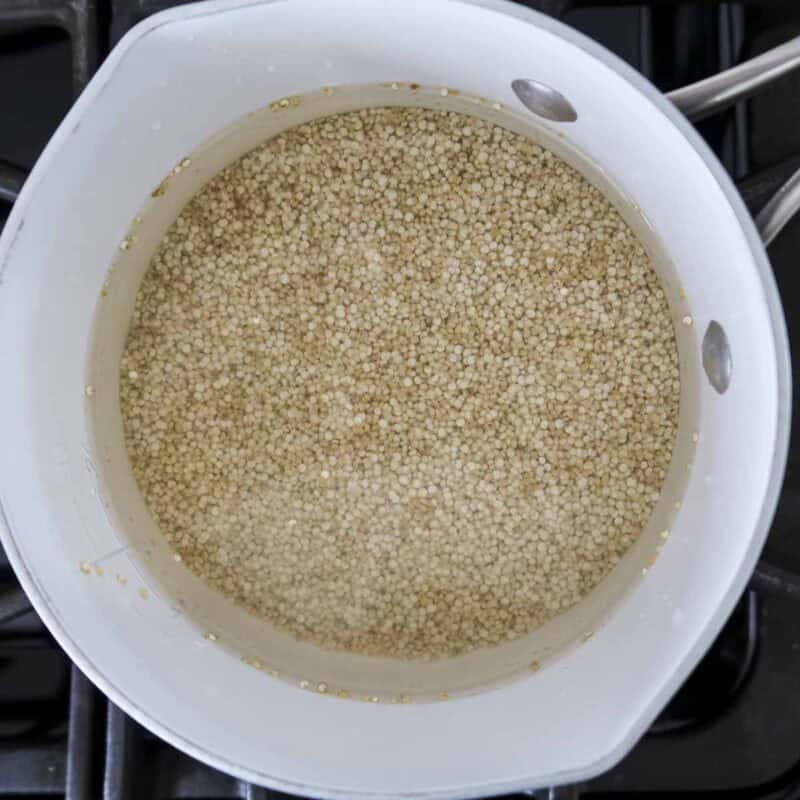 Overhead view of process shot 1 - cook quinoa according to package directions.