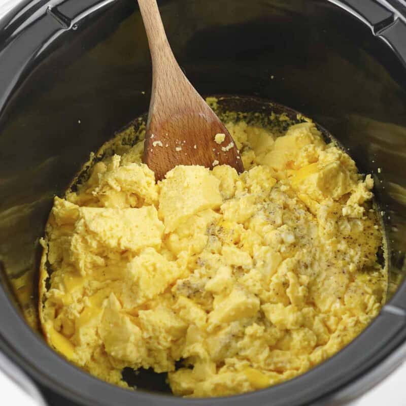 Side view of process shot 5 - when the eggs are cooked, break them up with a large spoon, but dont overmix in order to keep a good consistency.