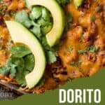 Close up shot of dorito casserole in pan lined with chopped cilantro and slices of avocado.