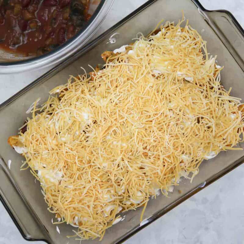 Overhead view of process shot 4 - distribute about ½ the cheese over the sour cream.