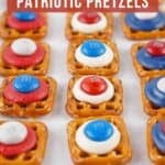 Close up shot of patriotic pretzels lined up on a baking sheet lined with parchment paper.